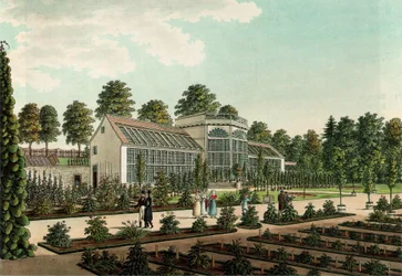 Invernadero en el antiguo jardín botánico de Göttingen, con la muralla de la ciudad al fondo